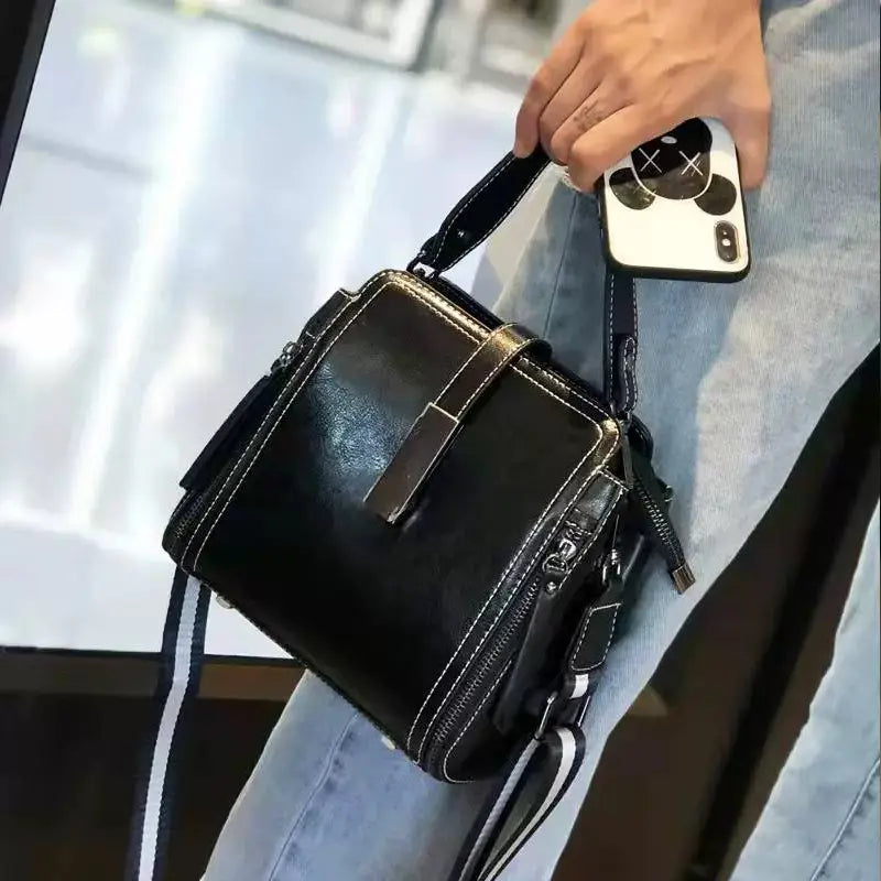 Elegante bolso bandolera de piel auténtica